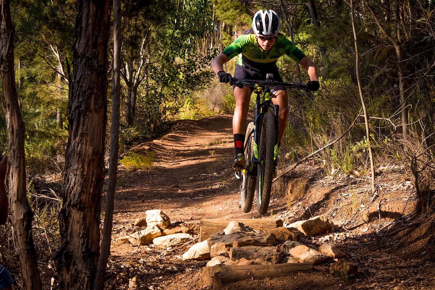 teenage mountain bike rider training on a summer evening for his next comeptition